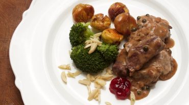 venison in pepper cream sauce with chestnuts and broccoli