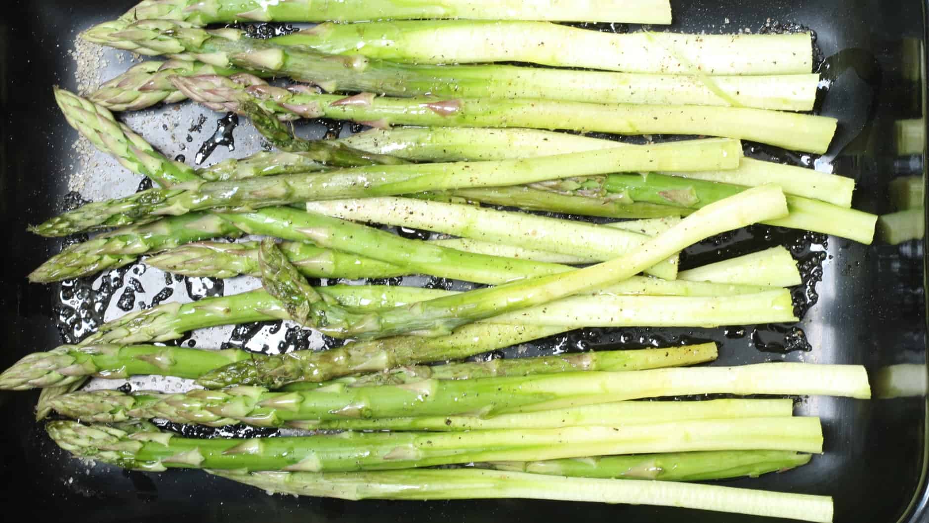 green asparagus prepared for oven grilling
