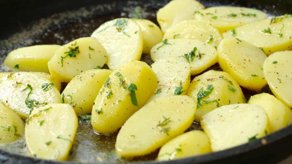 Butter potatoes with lovage as a side dish