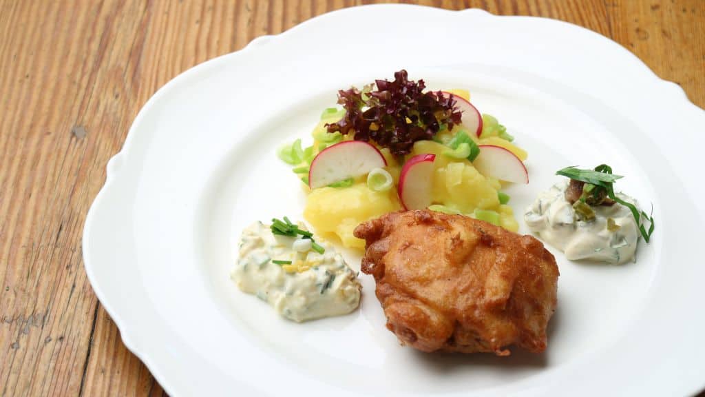 baked carp with potato salad. the bavarian classic in the christmas kitchen as christmas carp