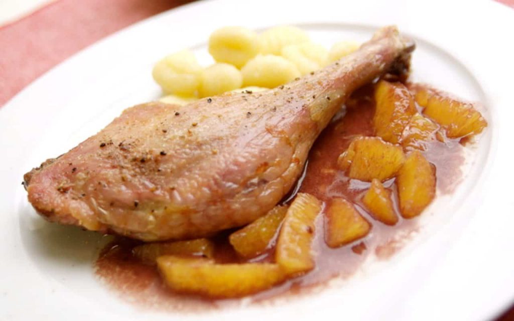 duck al orange a classic of fine gourmet cuisine here with gnocchi side dishes