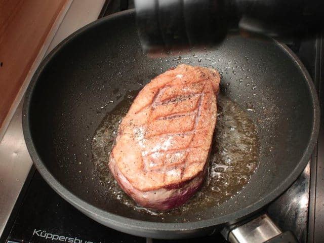 duck breast skin side with salt and pepper spices