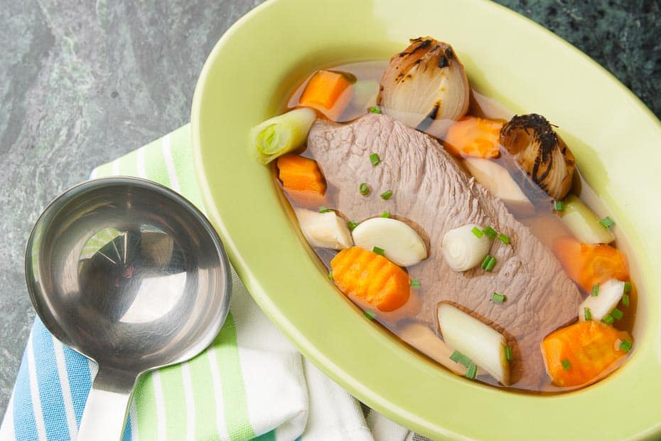 beef soup with boiled beef and soup vegetables
