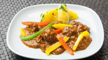 German pork goulash with peppers and potatoes