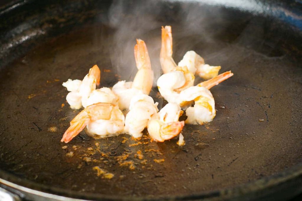 Prawn fried in a pan at high temperature
