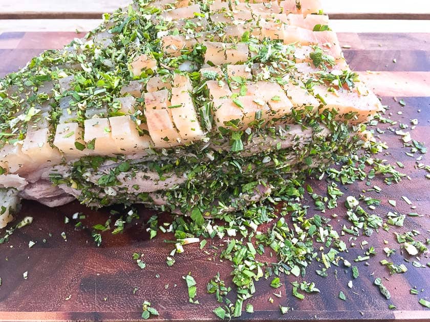 Roast pork filled with herbs and seasoned
