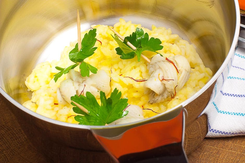 Saffron risotto tastes good with prawns and with fish.