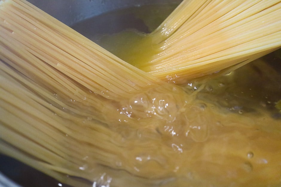 Spaghetti in a saucepan - salted water and olive oil