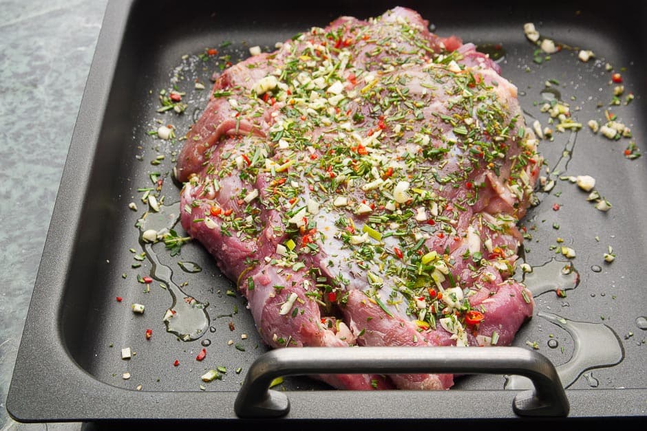 Roast lamb marinated before braising. The shoulder of lamb is ready for the oven.