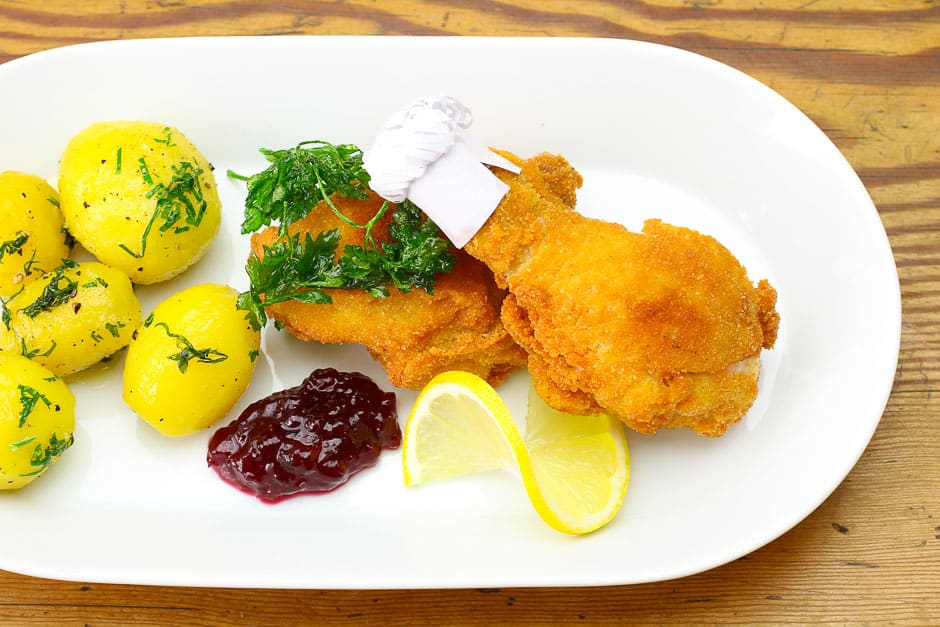 Baked chicken with side dishes aka original Bavarian chicken nuggets.