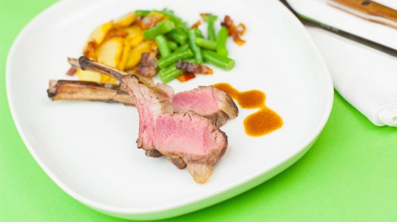 Saddle of lamb recipe with potatoes and beans.