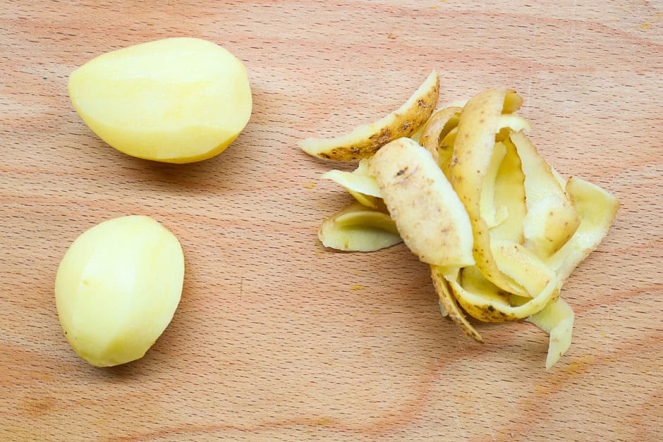 Peeled potatoes for the preparation of homemade potato cheese.