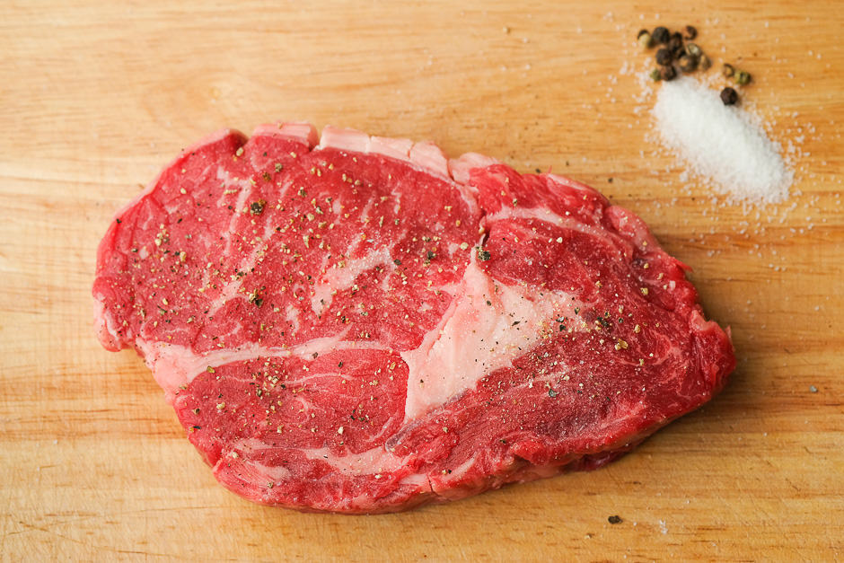 Season the steak before browning.