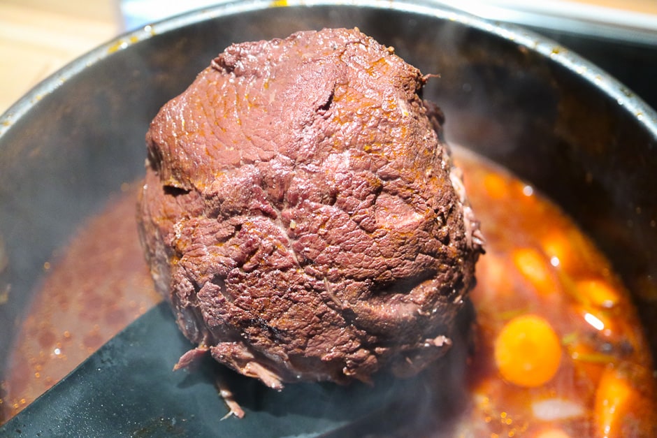 Roast beef fully cooked photographed in a pot.