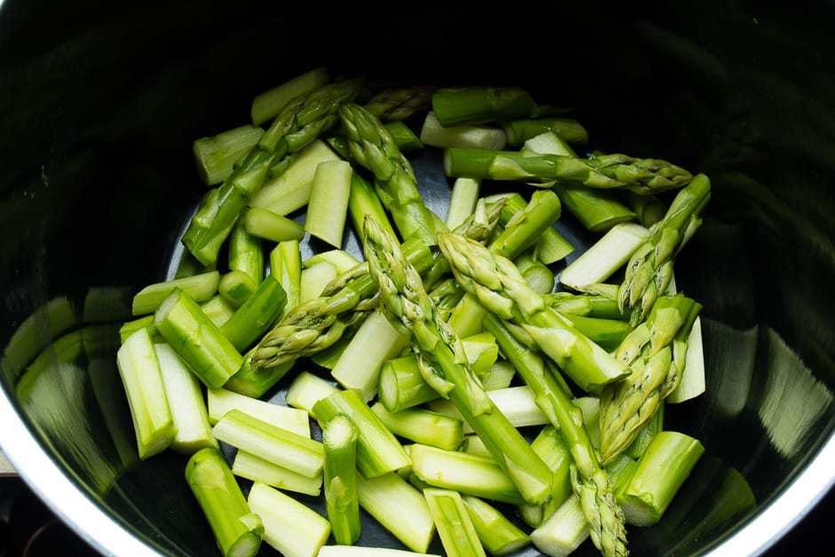 Asparagus vegetables raw in a pot