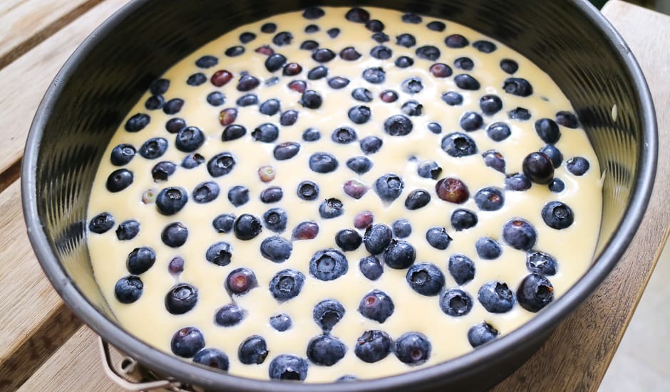 Unbaked blueberry cake in the baking pan.