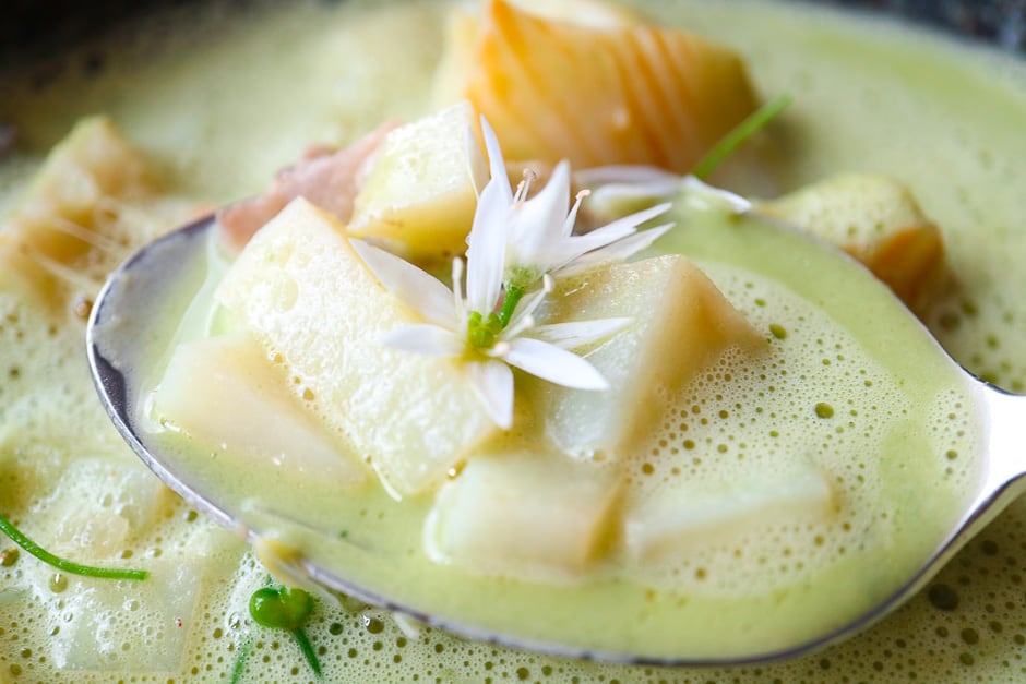 Wild garlic soup with fish in close-up