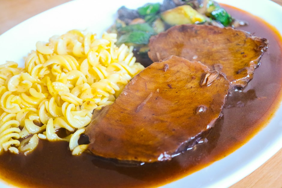 Serve the roast beef with sauce and side dish hot.