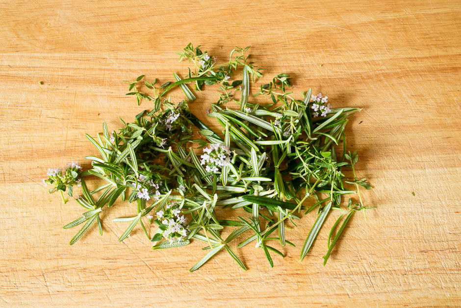 Pluck the herbs and lay them ready on a pile.