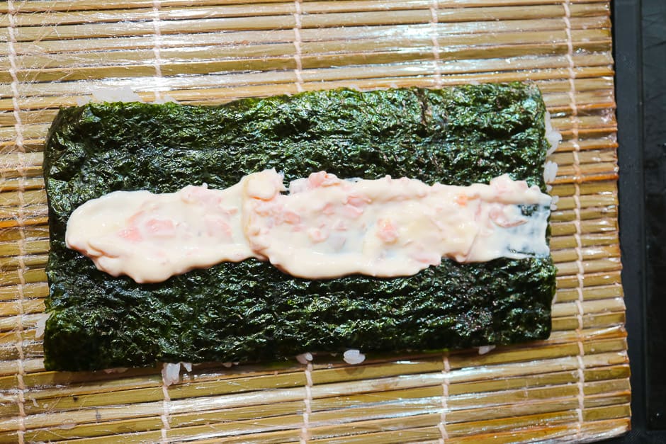 Turn the nori sheet over with rice