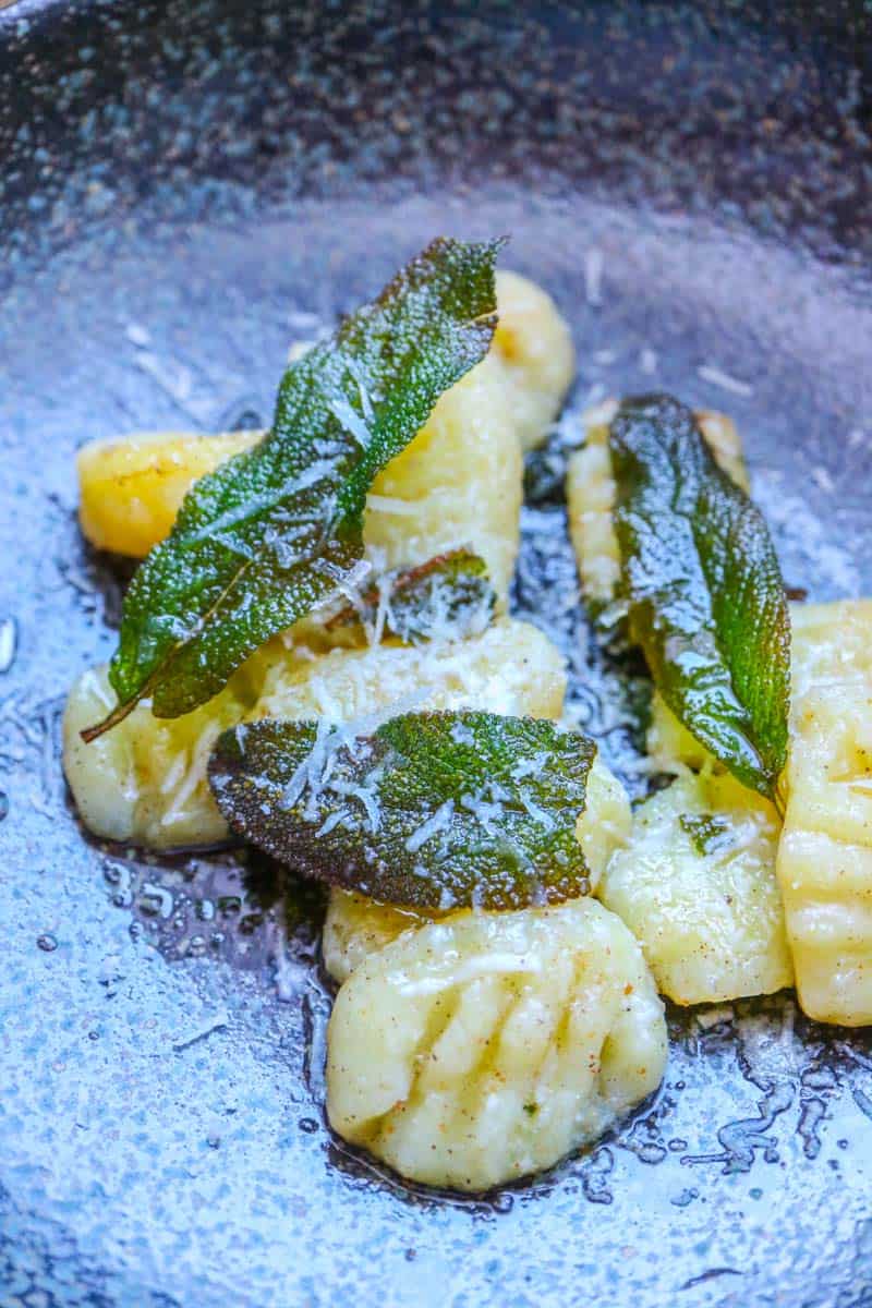 Gnocchi with sage butter served on the plate