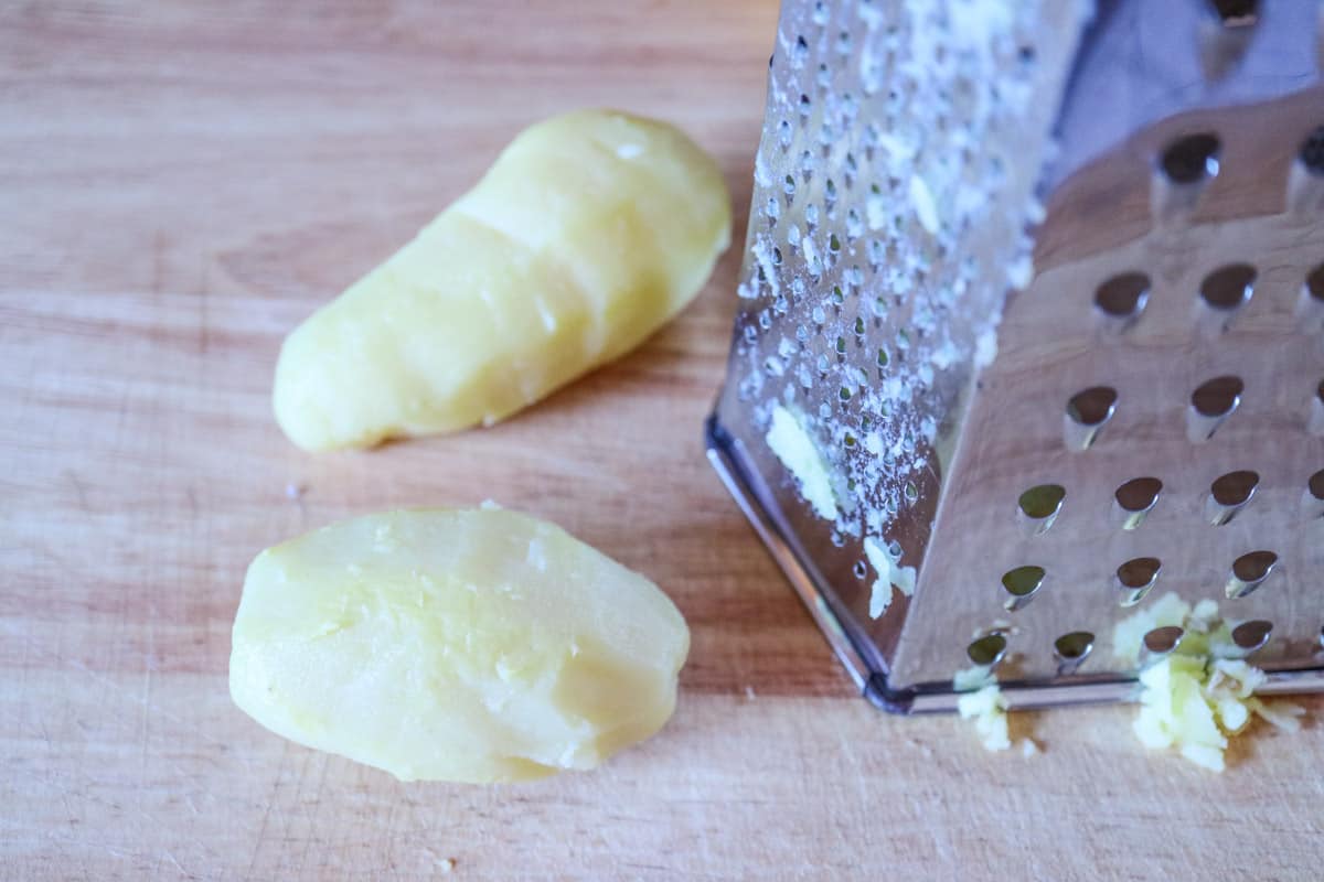 Boiled potato and grater