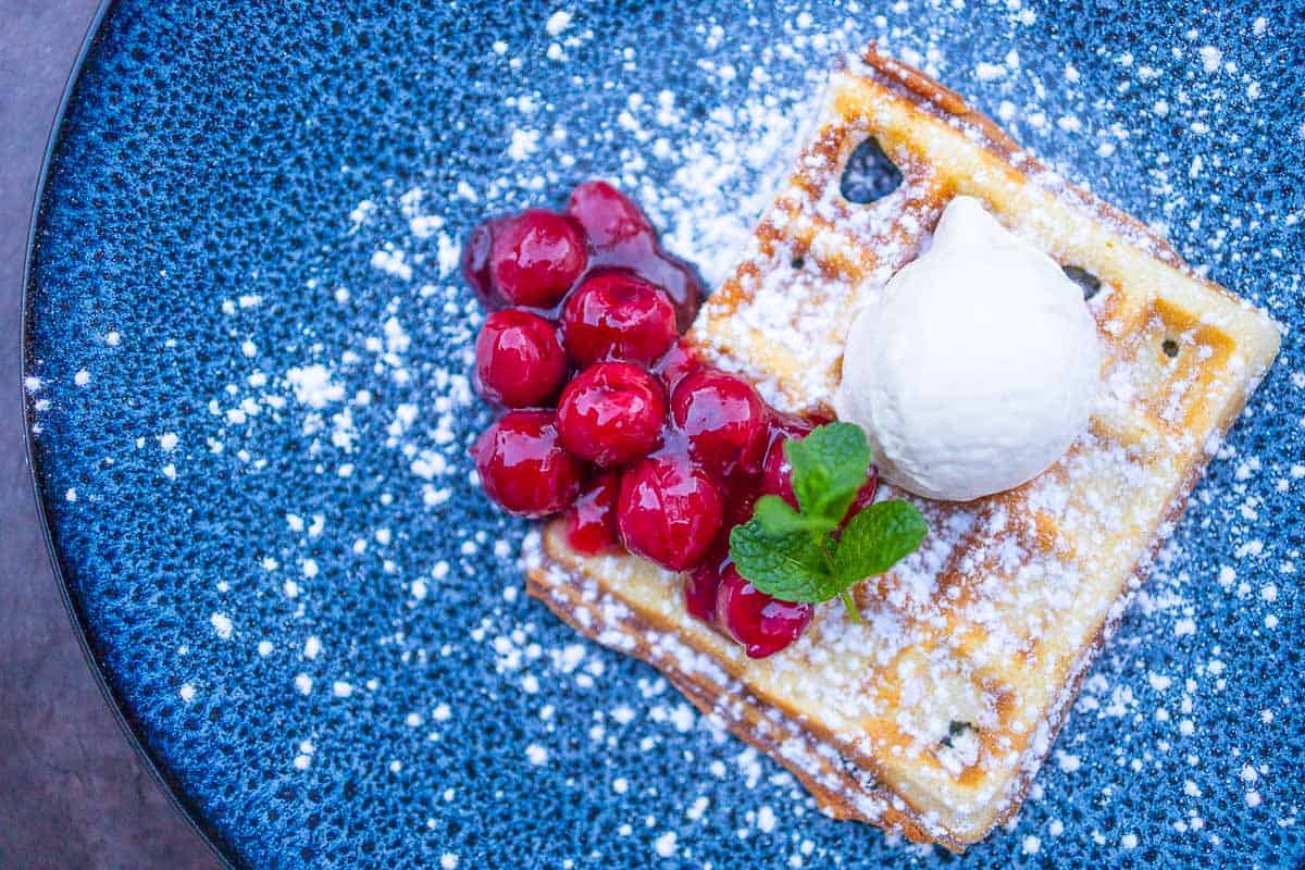 Waffles with hot cherries