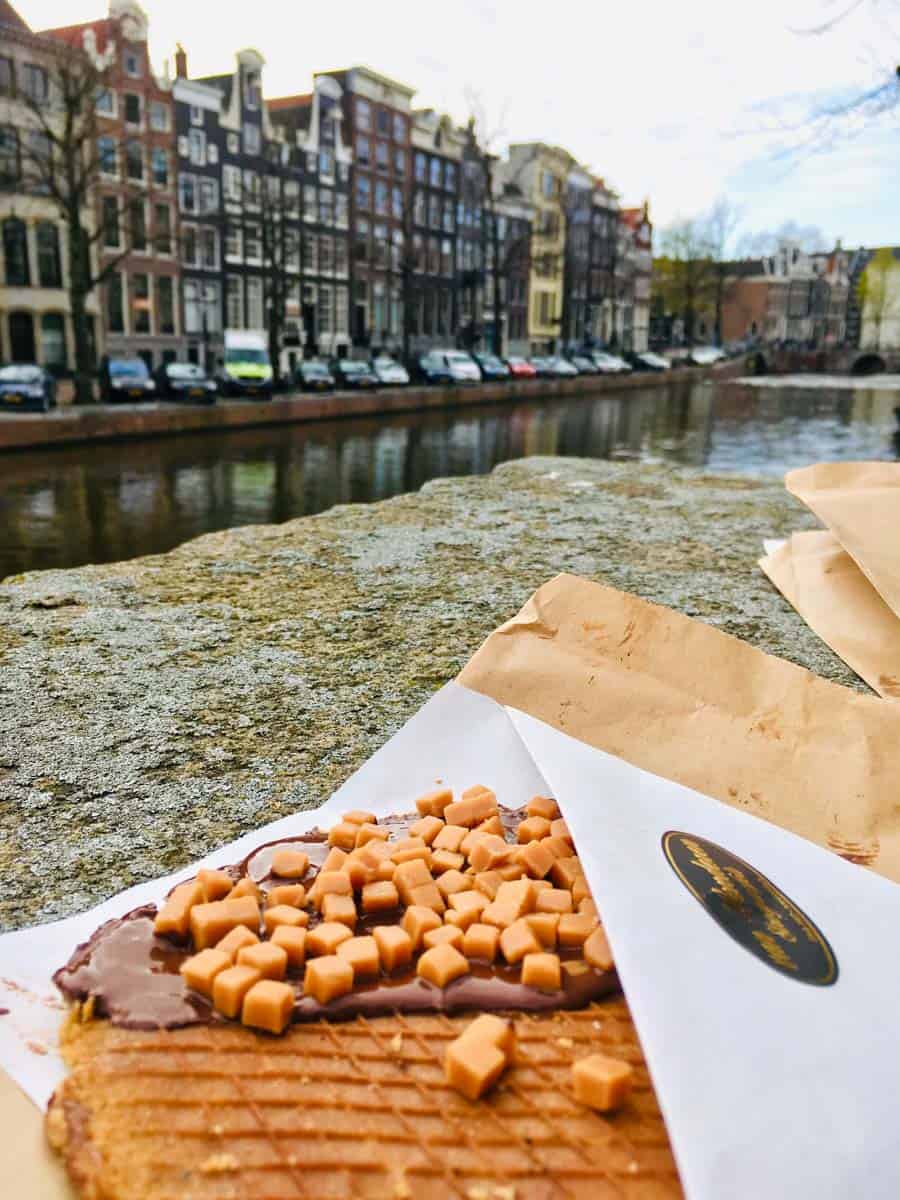 Eating waffles in Amsterdam on the canal