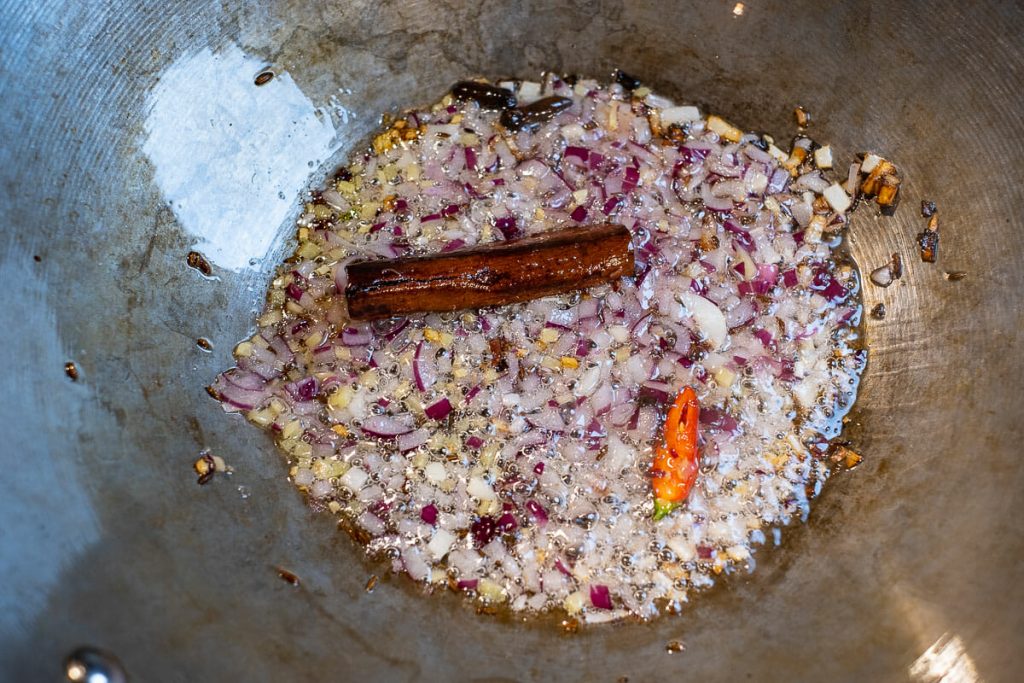 Onion and spices in a wok