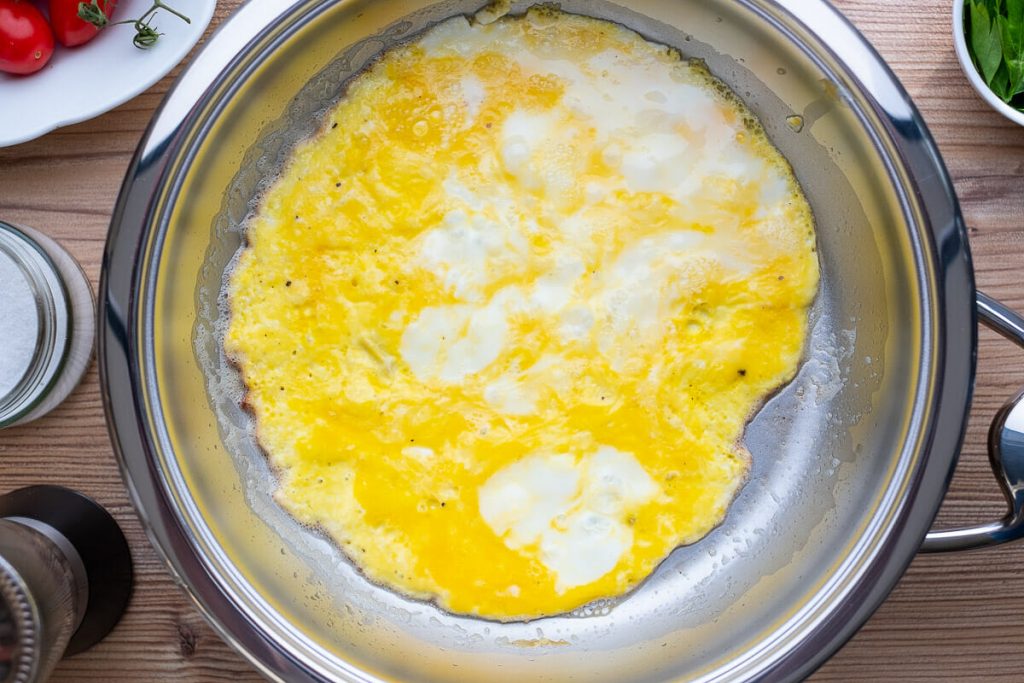 Omelette in the pan before turning