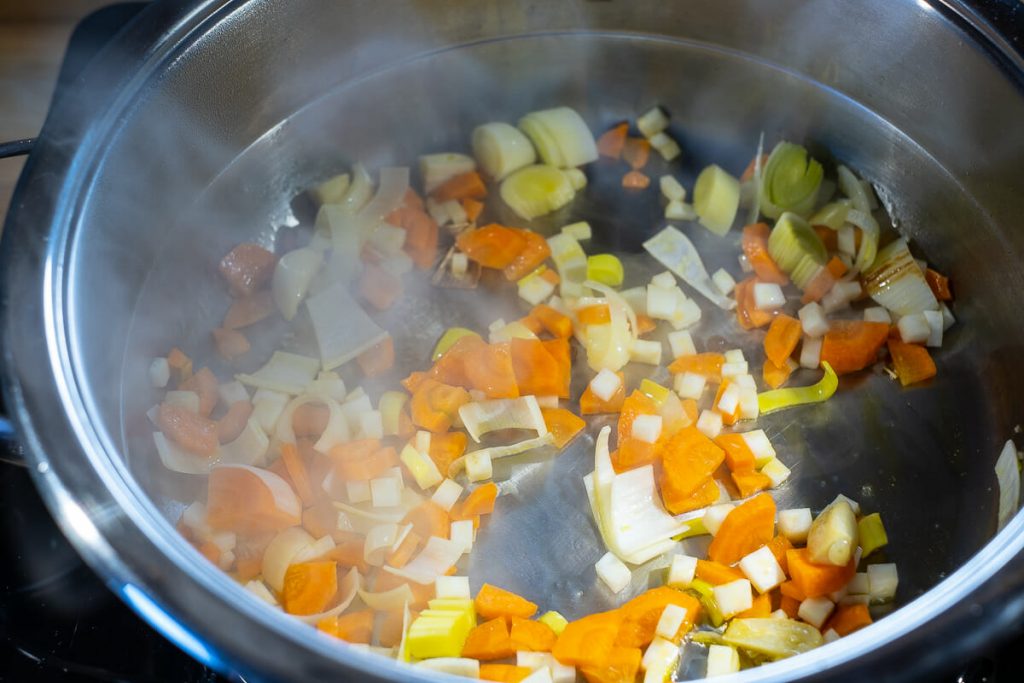 Sweat the vegetables in a saucepan