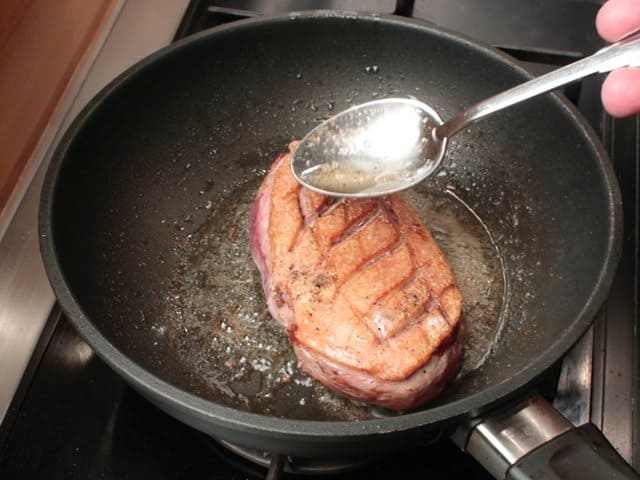 Pour the resulting gravy and duck fat over the duck breast.
