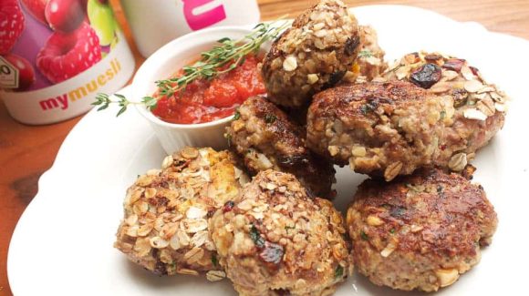 Meatballs wrapped in muesli with homemade ketchup.