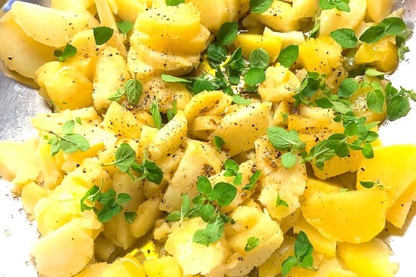 Olive oil potato salad while marinating