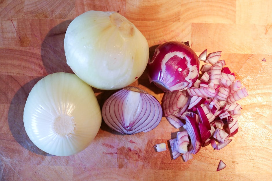 Yellow and red onion on the cutting board