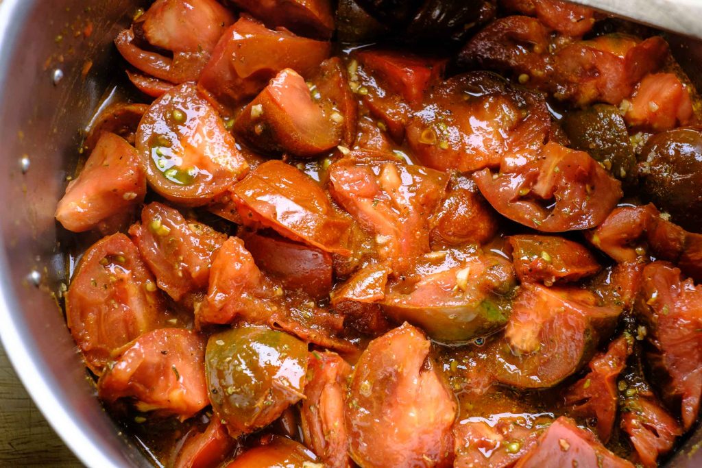 Boil tomatoes in pot