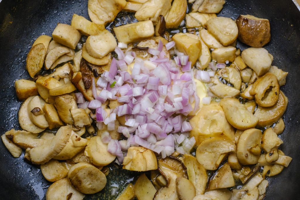 Mushrooms with onions in the pan