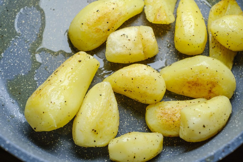 Jacket potatoes in the pan