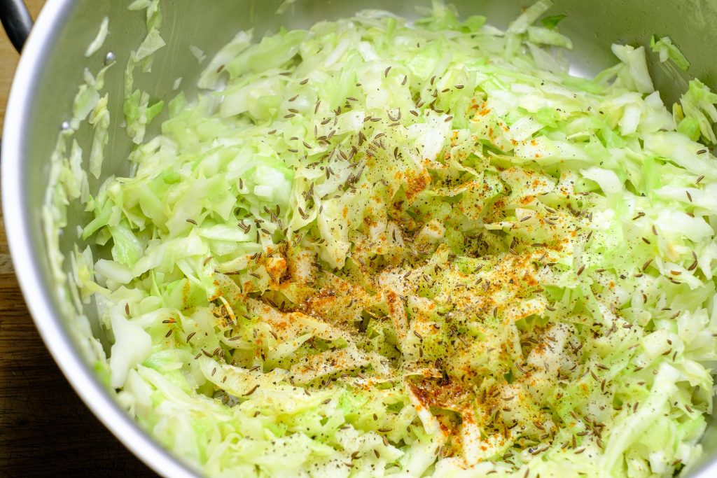 Sliced white cabbage with seasoning