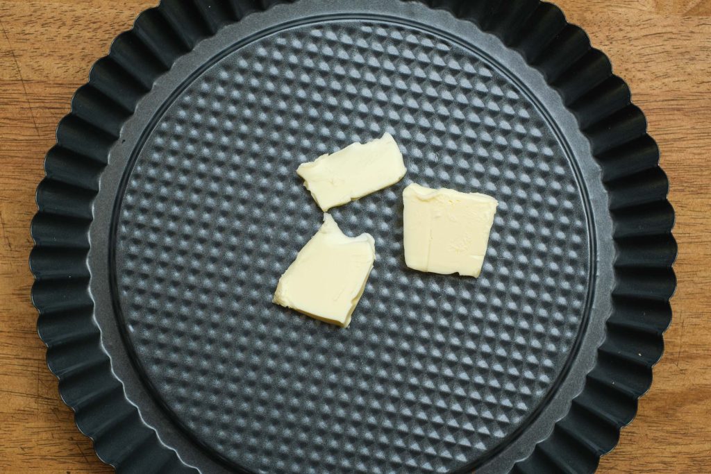 Baking pan with pieces of butter