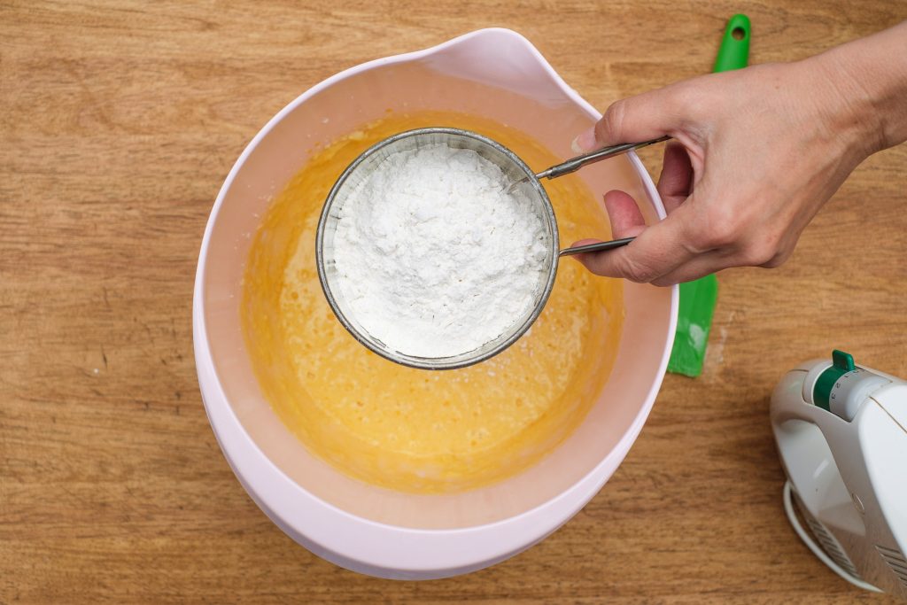 Flour and baking powder in sieve