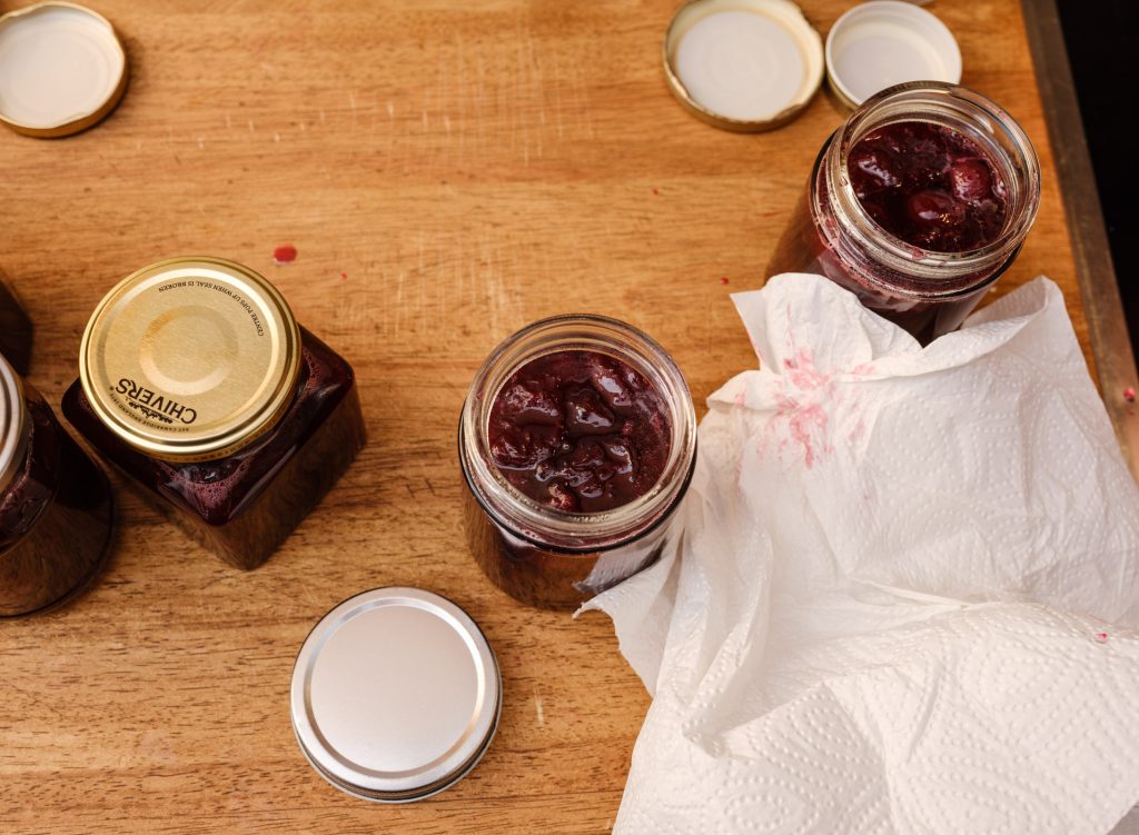Clean jam jars before sealing.