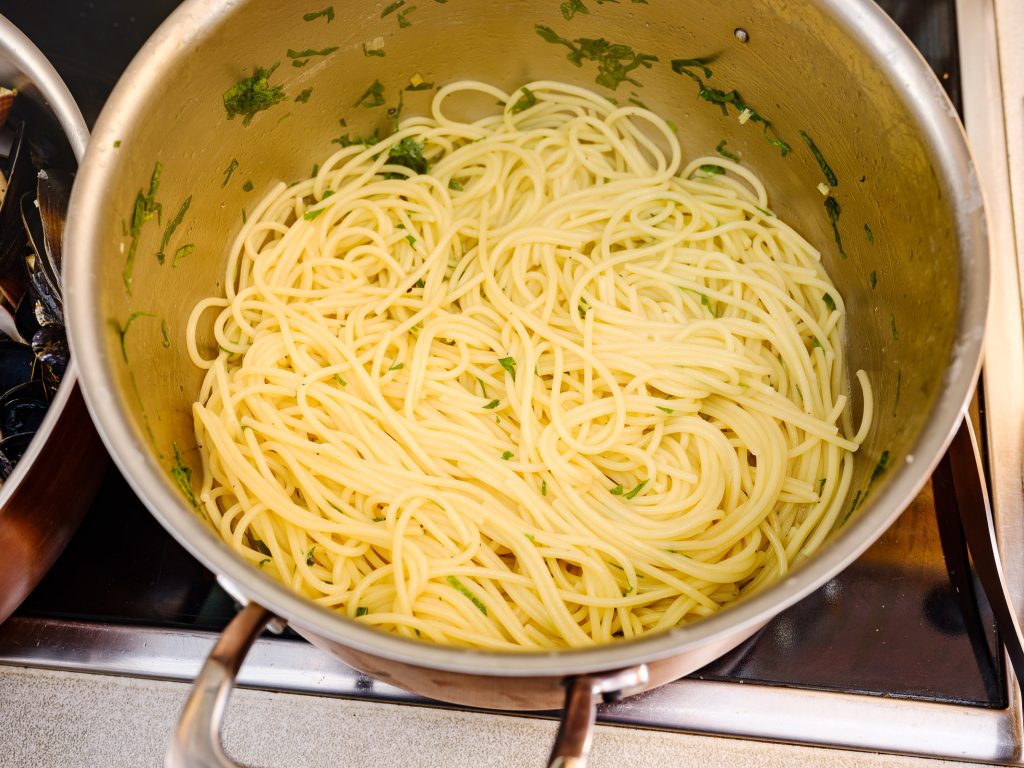 Spaghetti with clam broth and parsley