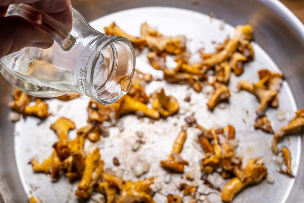 Deglaze mushrooms with white wine