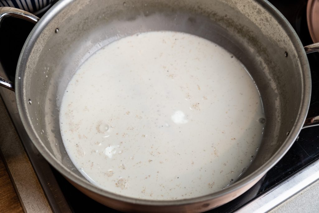 Boil the cream in the saucepan