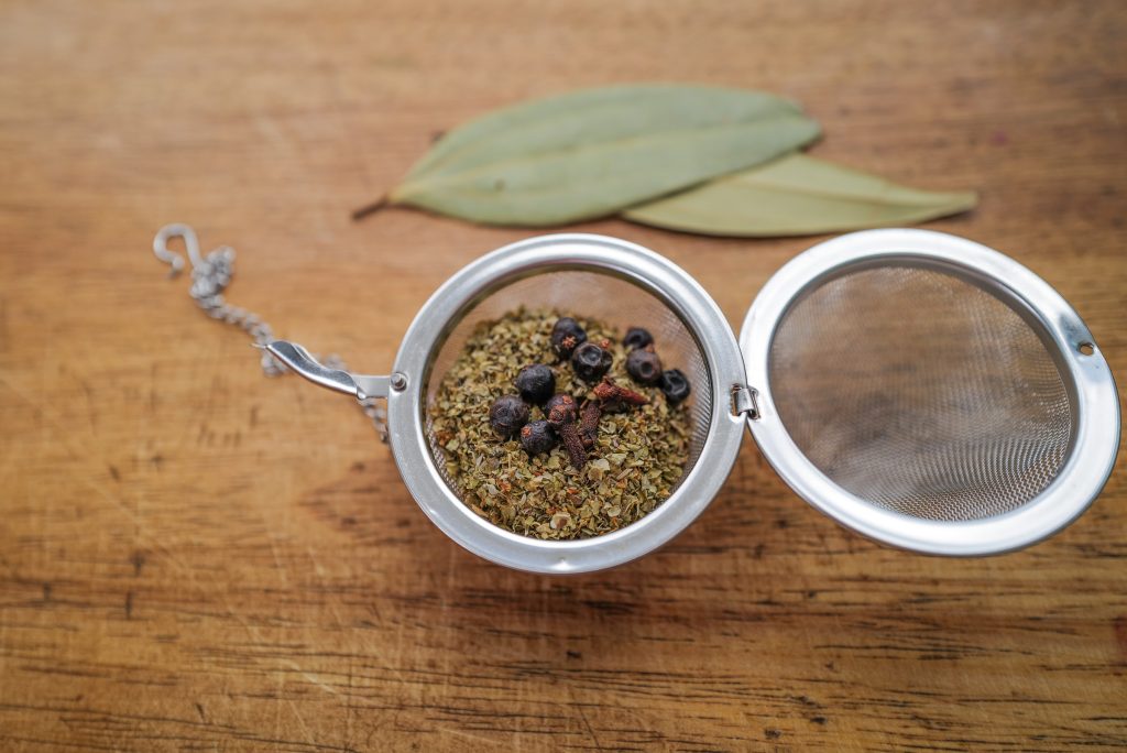 Open tea strainer with spices