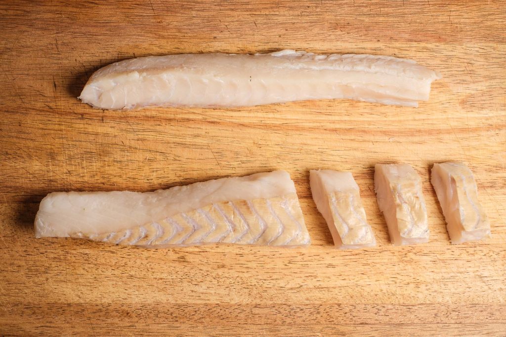 Cut pollock fillet for breading fish fingers