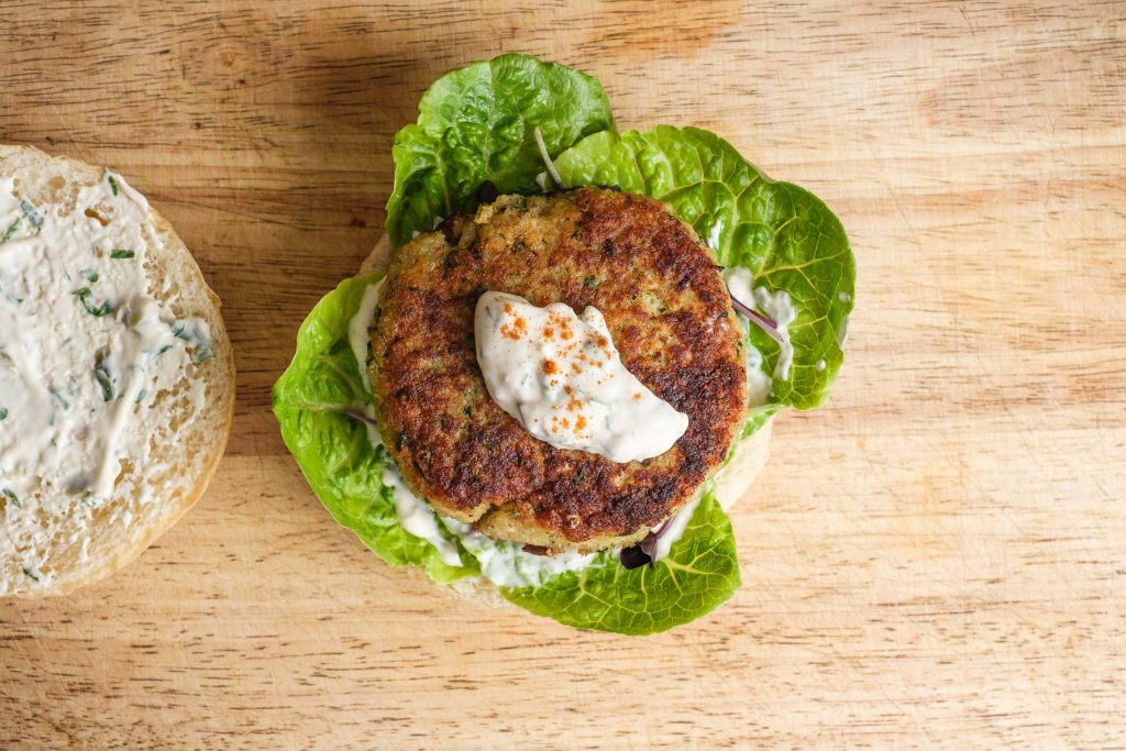 Top the fish cake with remoulade