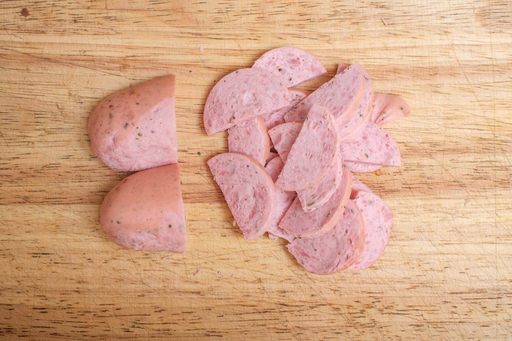 Cut the Regensburg sausage into slices