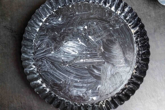 Mit Butter eingestrichene Tarteform